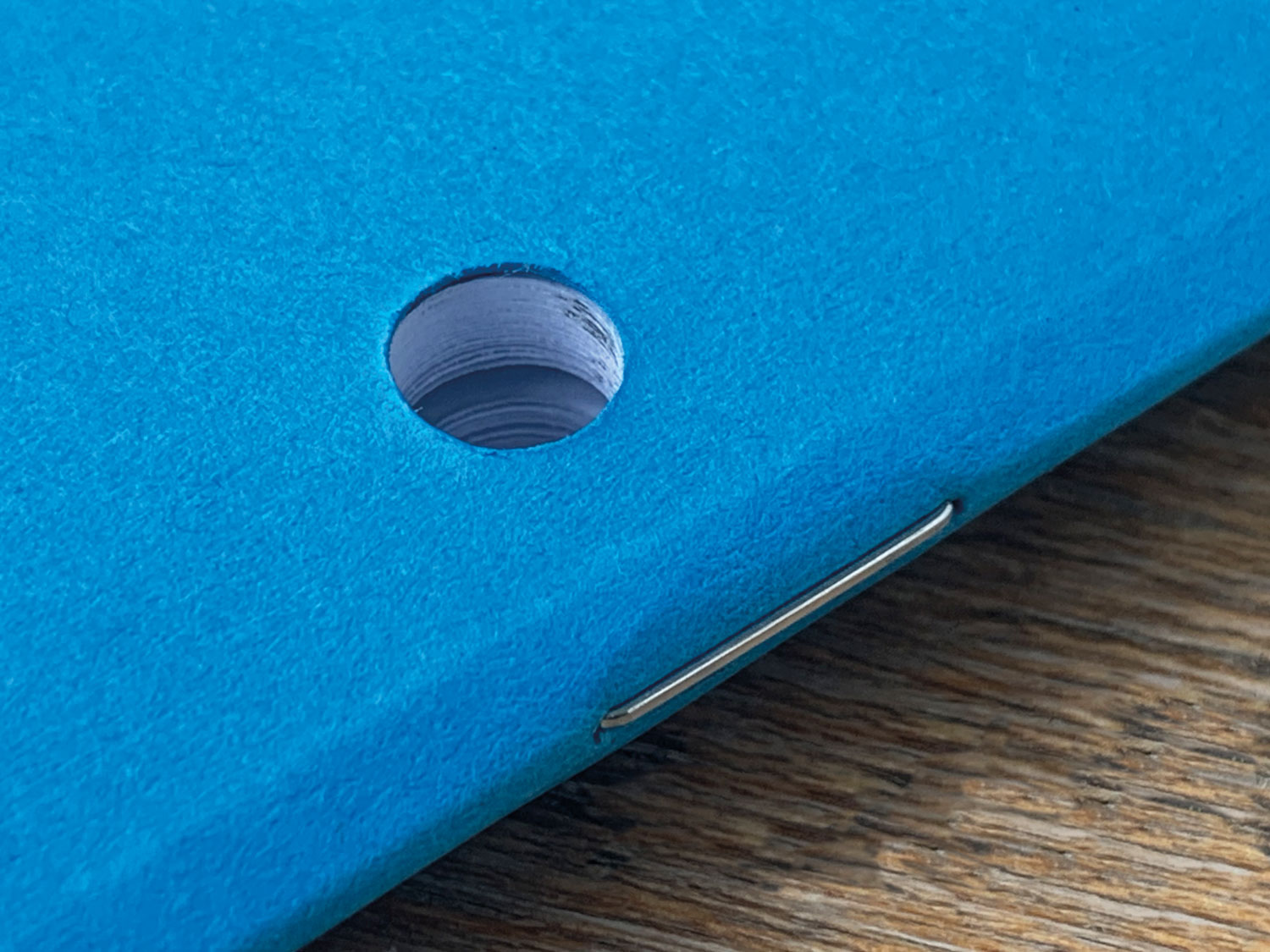 hole punched school exercise books - stapled
