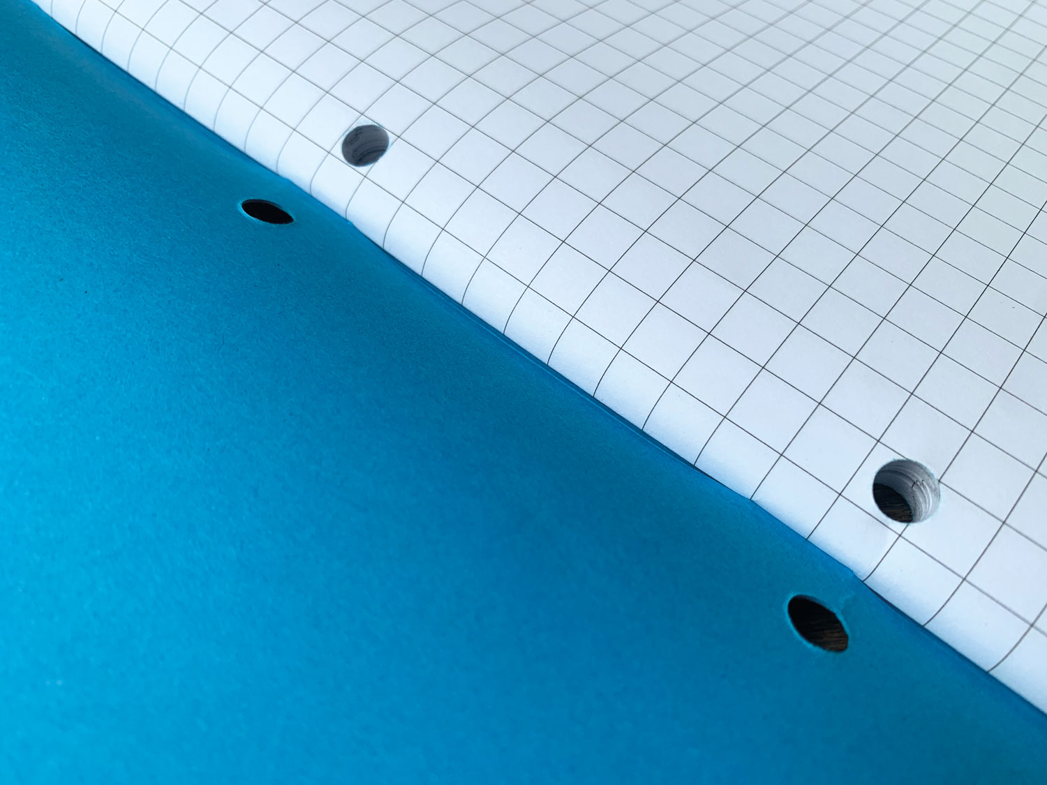blue cover - hole punched school exercise books